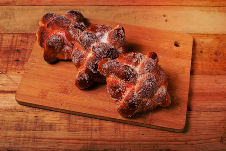 Pan de muertos on a wooden table. Typical Mexican dessert for the Day of the Dead. Top view.の写真素材