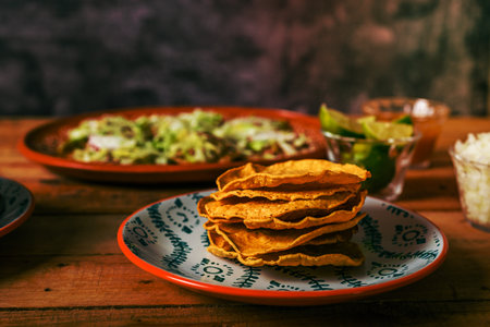 Tostada of corn, typical mexican food. Tostadas on a plate on a wooden table.の写真素材