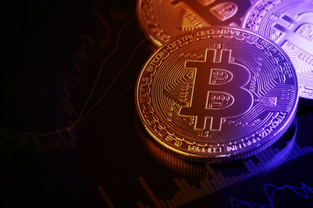 Bitcoins on investment money moving graph in background.Conceptual design for technology of Cryptocurrency and Blockchain.の写真素材