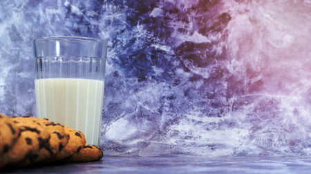 American gluten free chocolate chip cookies with glass glass of vegetable milk on gray background. Chocolate chip cookies. Sweet pastries, dessert. Culinary background. Copy space.の写真素材