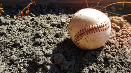 Closeup White leather textured baseball ball with red seams. Ball Outside Stadium Home Run Concept.の写真素材