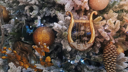 Close-up of a Christmas background. Celebration. Christmas tree with toys and decorative snow for a happy new year. Christmas decorations, New Year's atmosphere. Beautiful modern postcardの写真素材