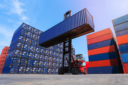 Logistic cargo container in shipping yard with cargo container stack in background.の写真素材