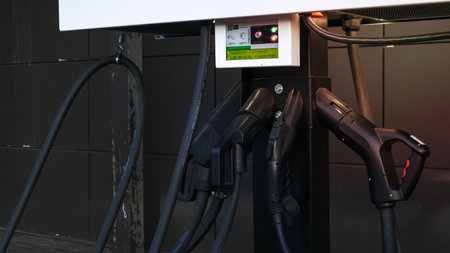 Public charging station for electric vehicles in the parking lot. Charger for public electric vehicles located in the parking lot. Ukraine, Kiev - June 14, 2021の写真素材
