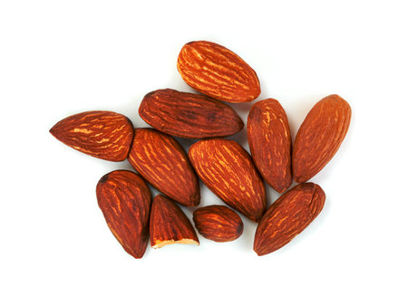 almonds natural roasted isolated on white backgroundの写真素材