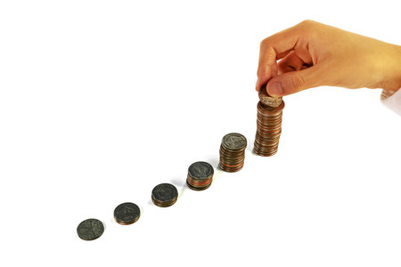 businessman holding coin with coins stacks on white backgroundの写真素材