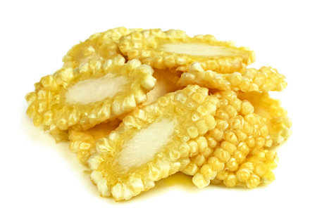 baby corn sliced isolated on white backgroundの写真素材