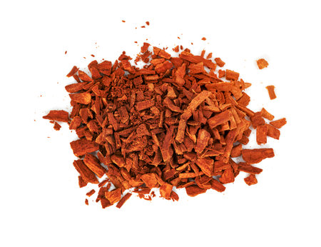 broken cinnamon sticks isolated on white backgroundの写真素材