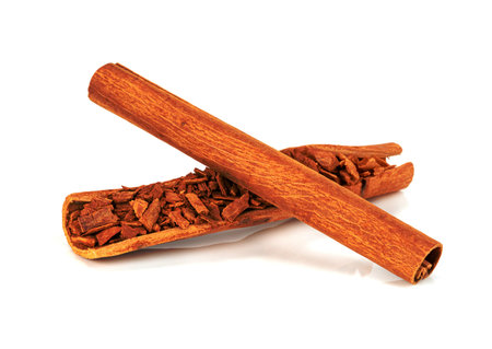 cinnamon sticks and powder isolated on white backgroundの写真素材