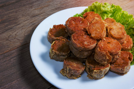 Deep Fried Crab meat roll or Hoi jo on wood  backgroundの写真素材