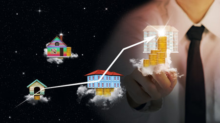building and gold coins on cloud with blurred businessman plan business growth and chart of indicators and black sky backgroundの写真素材