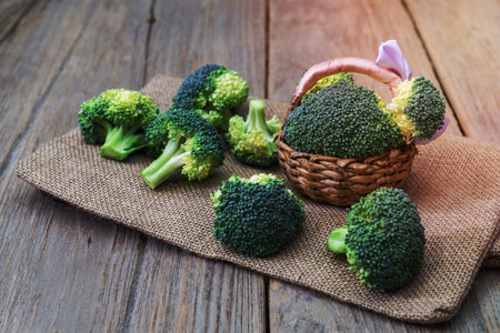 broccoli in basket  wood backgroundの写真素材