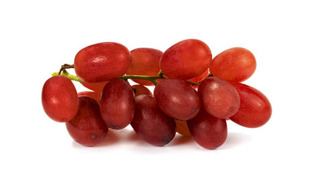 Closeup red seedless grapes isolated on white backgroundの写真素材