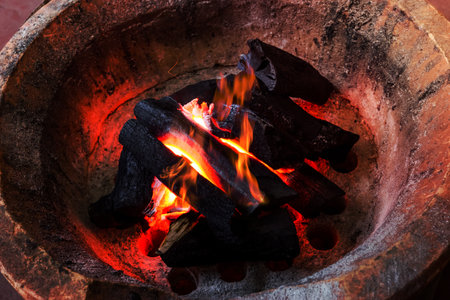 coal stove with flameの写真素材