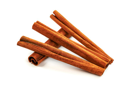 cinnamon sticks isolated on white backgroundの写真素材
