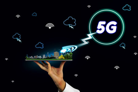 5G network interface and icon concept,businessman holding a tablet with city model in handsの写真素材