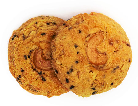 butter cookies with cashew nuts and chocolate chip isolated on white backgroundの写真素材