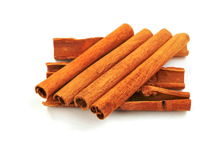 cinnamon sticks isolated on white backgroundの写真素材
