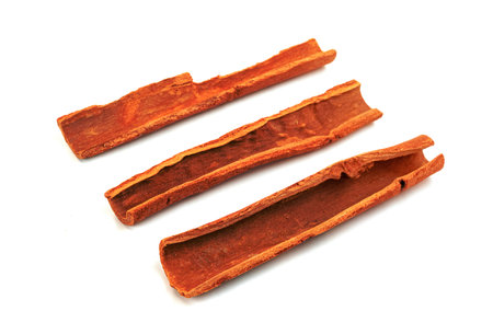 cinnamon sticks isolated on white backgroundの写真素材
