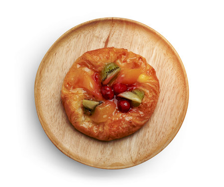 danish pastry with fruits in wooden dish isolated on white background ,include clipping pathの写真素材