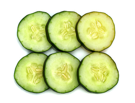 Fresh japanese cucumber sliced isolated on white backgroundの写真素材