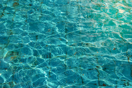 dirty condition water reflecting in the sunの写真素材