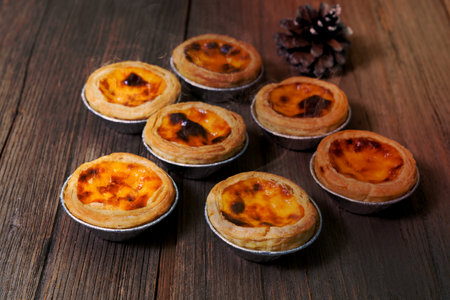 egg tart in aluminum foil cup with smoke

on wood tableの写真素材