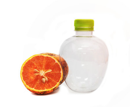orange with empty plastic bottle isolated on the white background,Thai fruitの写真素材