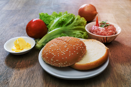 hamburger bun on dish and vegetable with minced pork,homemadeの写真素材