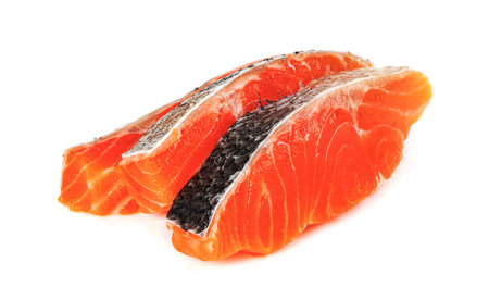 Piece of fresh salmon fillet sliced isolated on white backgroundの写真素材
