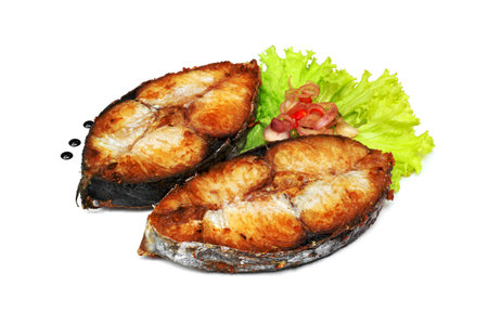King mackerel or spotted mackerels steak isolated on white background ,fried Scomberomorus fishの写真素材
