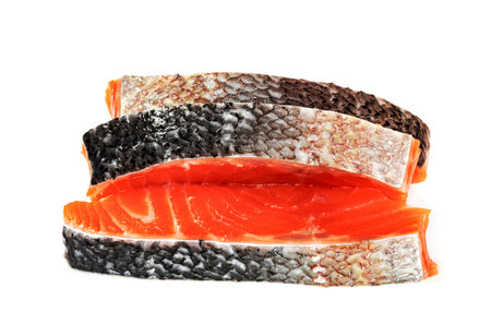 Piece of fresh salmon fillet sliced isolated on white backgroundの写真素材