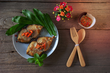 King mackerel steak on wood background,fried fishの写真素材