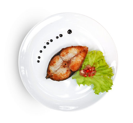 King mackerel or spotted mackerels steak with dish isolated on white background ,fried Scomberomorus fish ,include clipping pathの写真素材