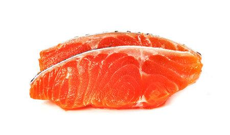 Piece of fresh salmon fillet sliced isolated on white backgroundの写真素材