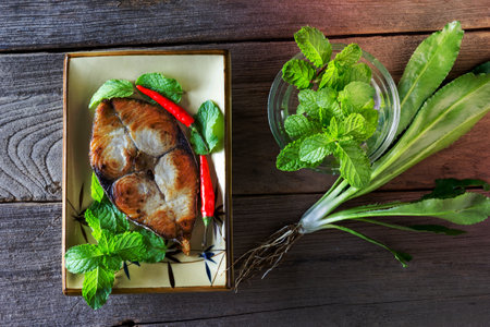 King mackerel steak on wood background,fried fishの写真素材