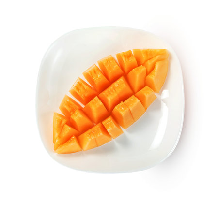Orange cantaloupe melon fruit sliced on dish isolated on white background ,include clipping pathの写真素材