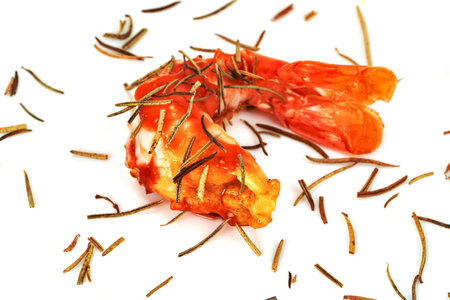 roasted peeled prawn with dry rosemary isolated on white background ,grilled shrimpの写真素材
