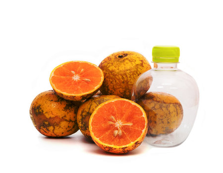 orange with empty plastic bottle isolated on the white background,Thai fruitの写真素材