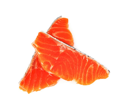 Piece of fresh salmon fillet sliced isolated on white backgroundの写真素材