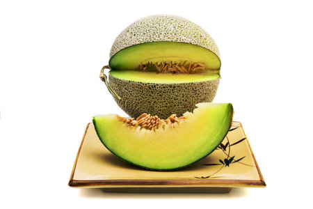 green melon isolated on white backgroundの写真素材
