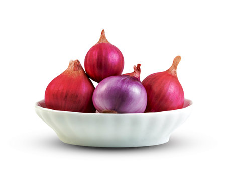 shallots onion in bowl isolated on a white background ,include clipping pathの写真素材