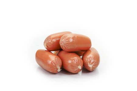 pork sausages isolated on white backgroundの写真素材