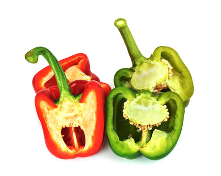 red green sweet bell pepper sliced isolated on white backgroundの写真素材