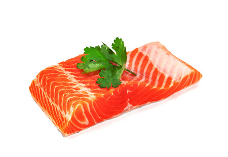 Piece of fresh salmon fillet sliced isolated on white backgroundの写真素材