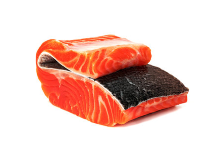 Piece of fresh salmon fillet sliced isolated on white backgroundの写真素材