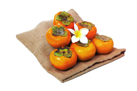 Persimmon with sack isolated on white backgroundの写真素材