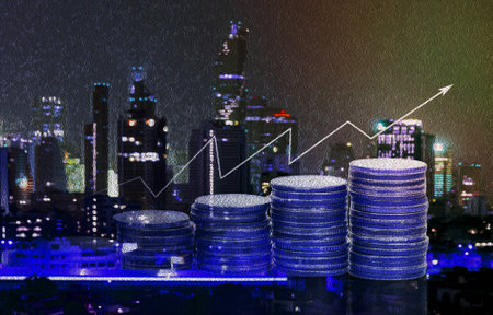 Abstract blue oil paint with stacked coins and cityscape for economic growth and business conceptの写真素材