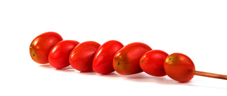 cherry tomato with wood skewer isolated on white backgroundの写真素材