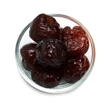 Chinese date or Jujube or monkey apple in syrup with glass bowl isolated on white backgroundの写真素材